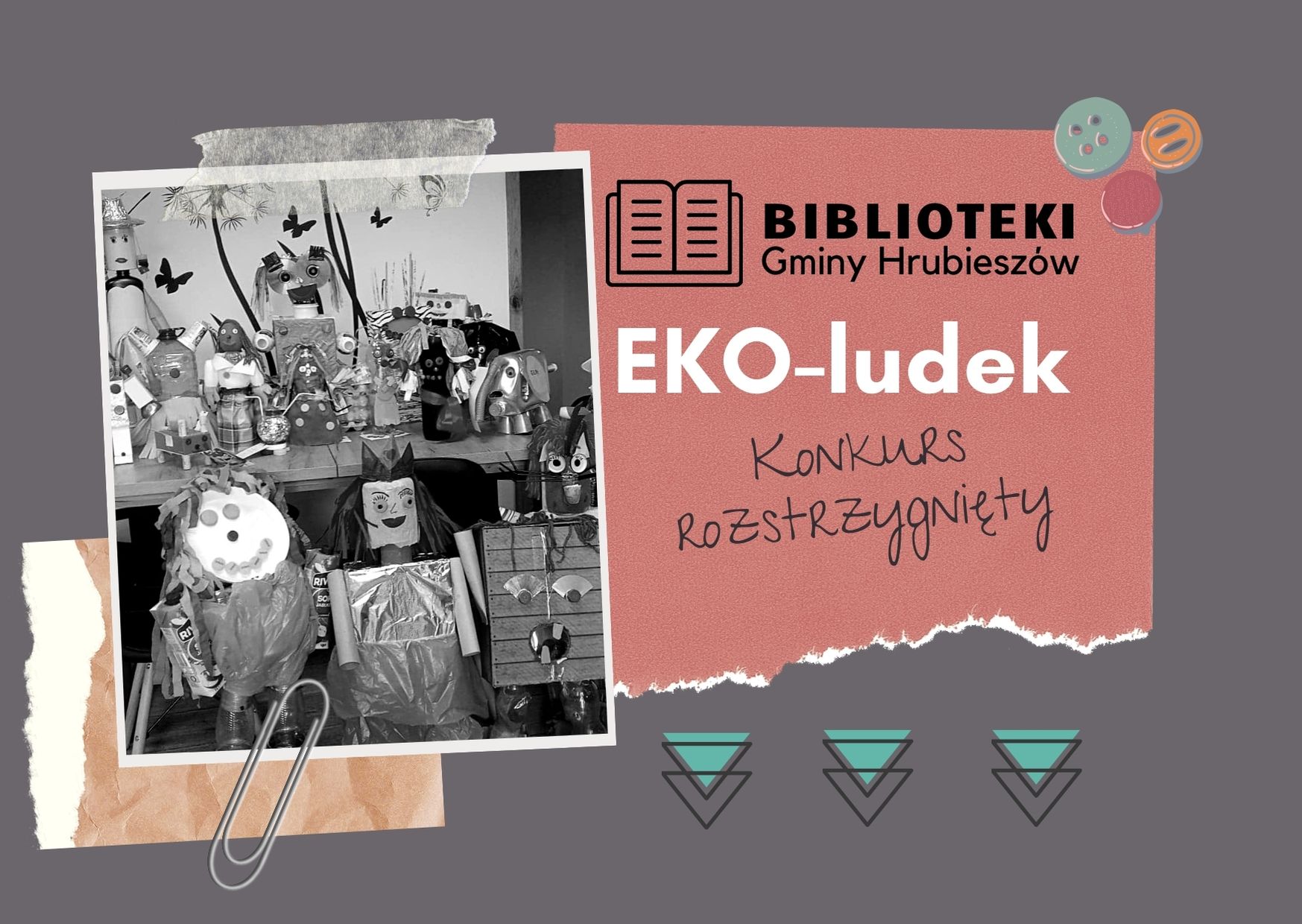 Szara plansza na której leżą różne kartki, pogniecione, wyrwane. Zdjecie robotów ekologicznych przyczepione spinaczem do papieru. Na jednej z kartek napis EKO-ludek konkurs rozstrzygnięty