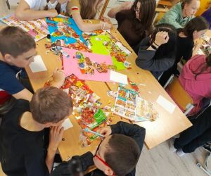 Uczniowie klas starszych pracują nad plakatami dotyczącymi zdrowego żywienia